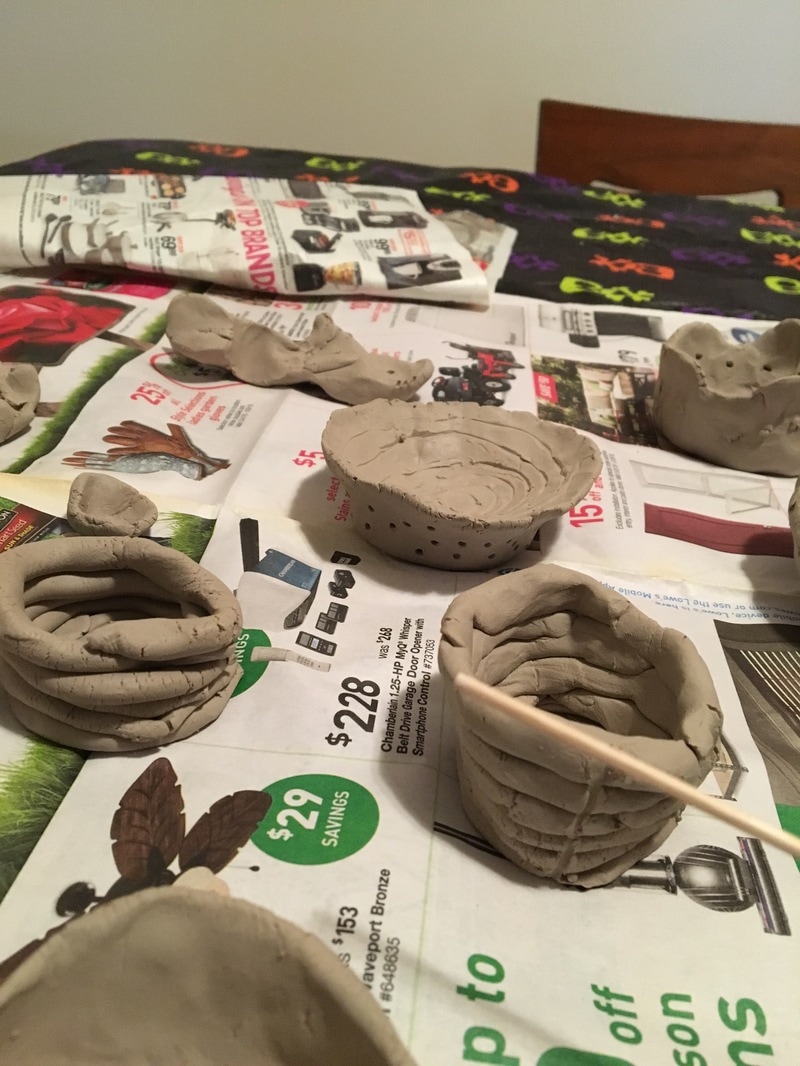 Several clay pots made by students from Arcadia